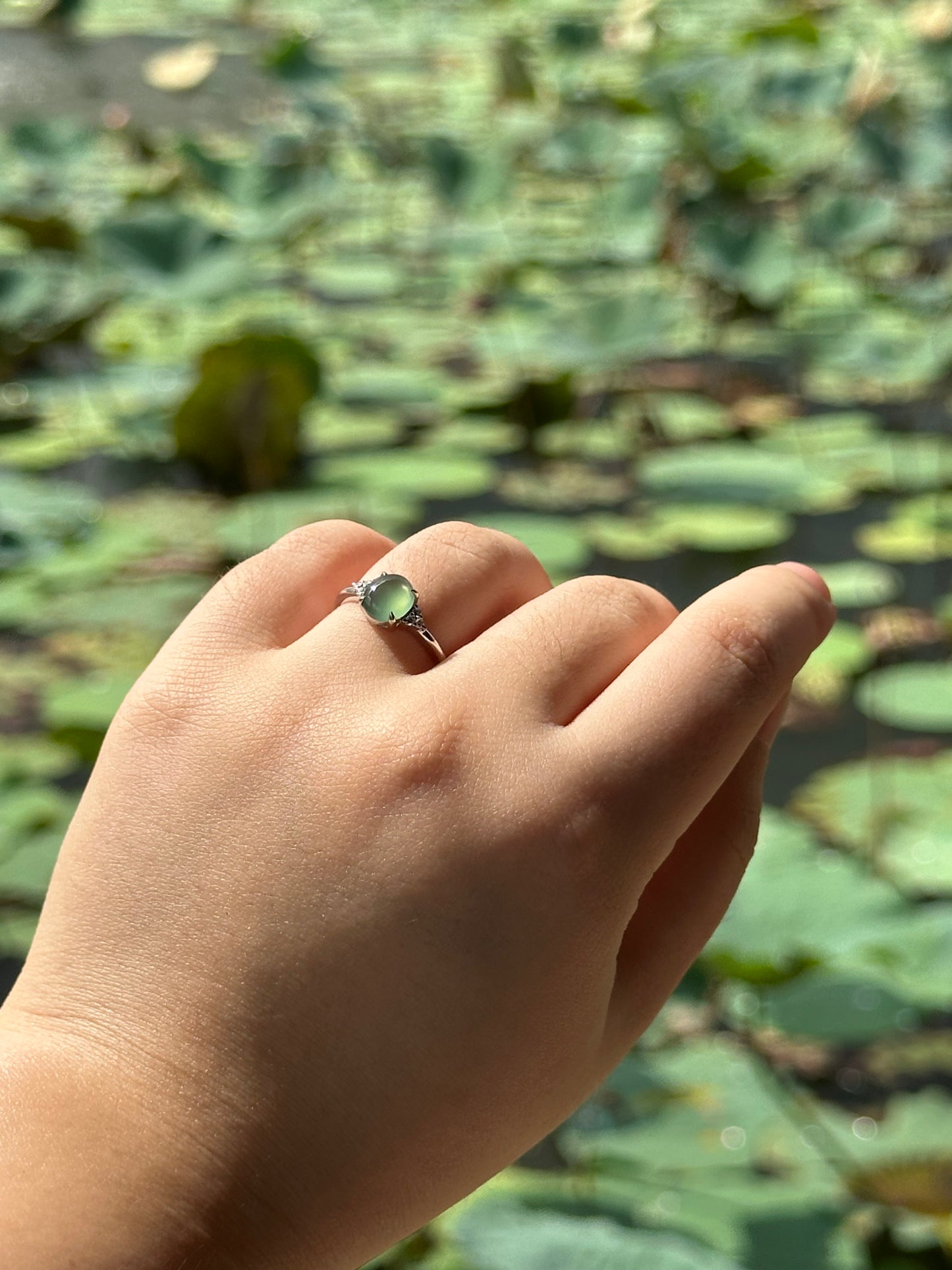 JO230016 A Drop in the Lake | Icy Blue watery jadeite cabochon in 18K white gold with natural diamonds