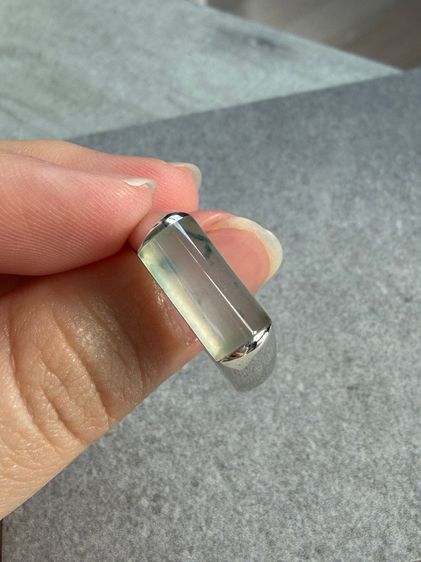 JO230013 Sprout in the Water | Icy Jadeite with Green and Yellow Marbling in Saddle Shaped Cabochon in 18K White Gold Ring